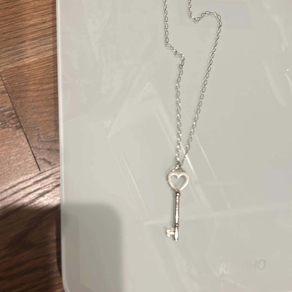 Gorgeous and timeless Tiffany pendant key with heart.